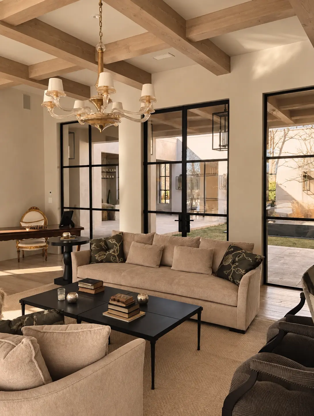 Bona Terra living room framed by steel windows and pale timber beams